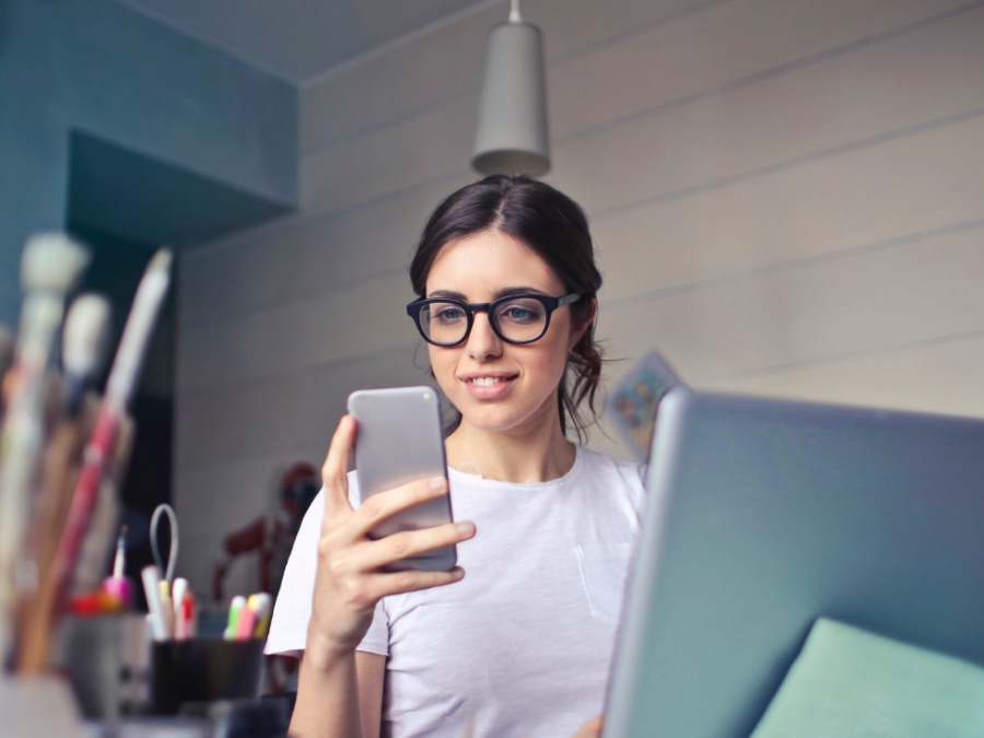 Woman looking at cell phone screen