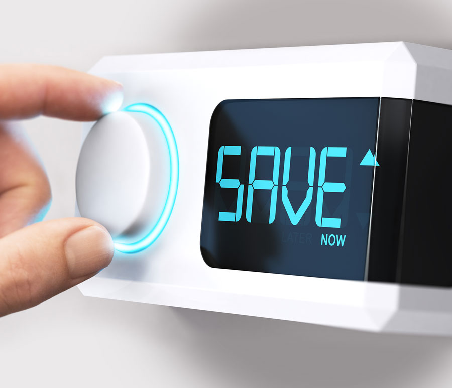 fingers adjusting programmable thermostat