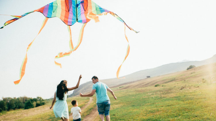 family flying a kite