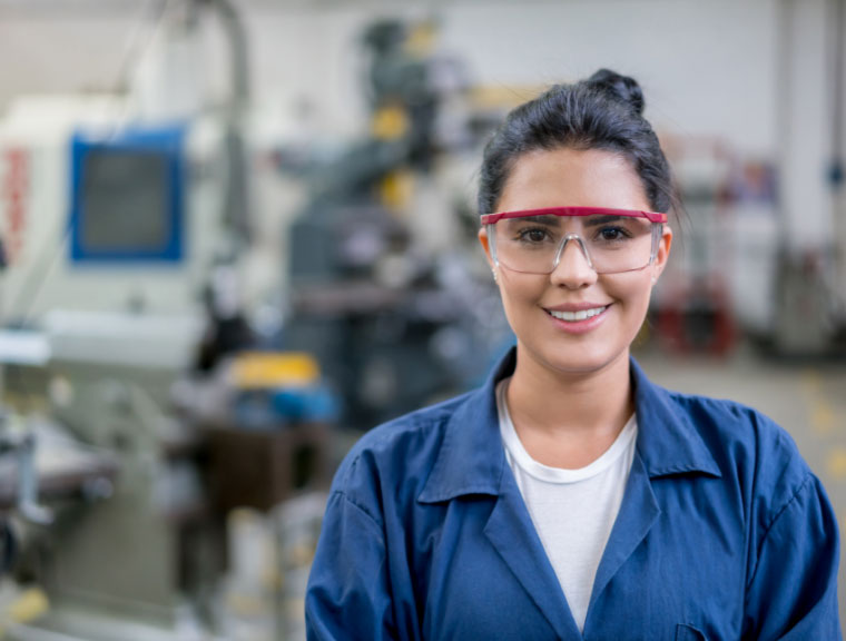 Student Helper wearing safety glasses and smiling